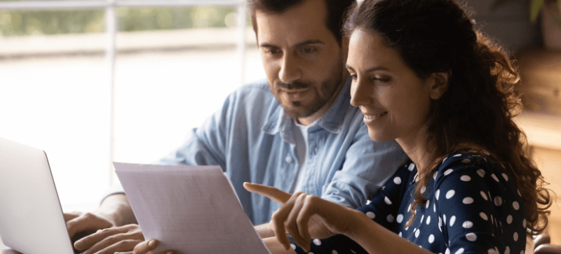 couple looking at insurance paperwork